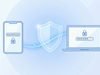 Смартфон з кодом підтвердження та ноутбук з екраном входу як приклад двофакторної автентифікації